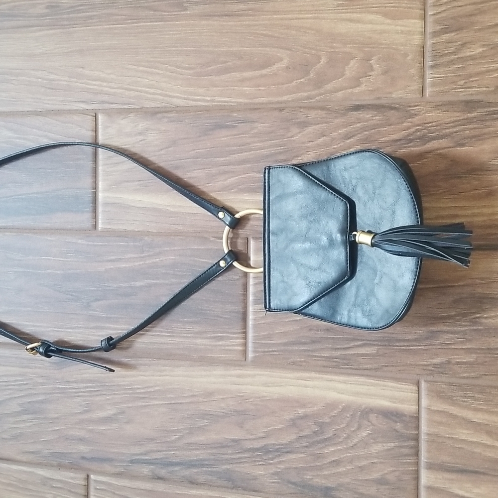 BIG BUDDHA BLACK PURSE WITH GOLD ACCENTS.